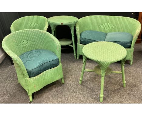 An early/mid 20th century Lloyd Loom Garden/Conservatory suit, comprising two seater sofa, pair of arm chairs, all with with 