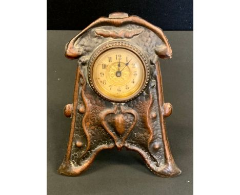 An Art Nouveau desk clock time piece, shaped embossed copper front, Arabic numerals, the movement marked British United Clock