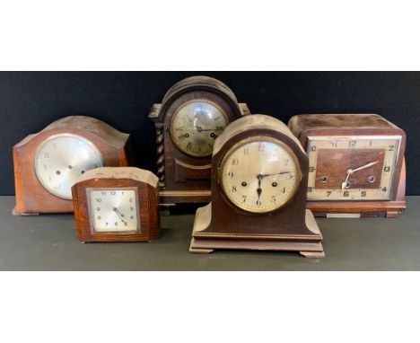 A late 19th century oak mantel clock, Roman numerals, twin winding holes, domed case, turned pilasters, bracket feet, 31cm hi