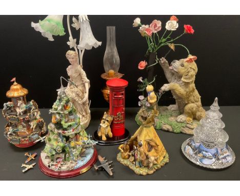 A large Leonardo Collection figure,  of a model of a Terrier and Post Office Box, 26cm high;  a resin puppy and flower group,