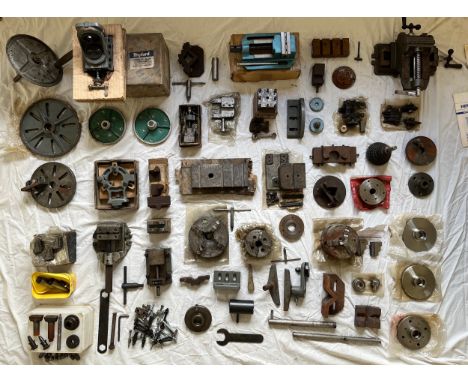 A collection of metalworking tools and equipment including vices, Myford vertical slides, metalworking lathe plates; a painte