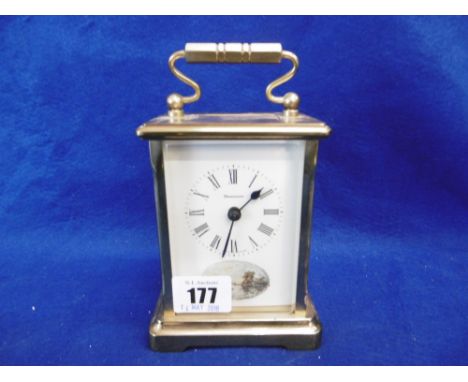 A CARRIAGE CLOCK WITH HAND PAINTED DIAL