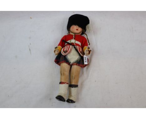 Felt soldier girl soft toy in kilt, in good condition with grubby areas, glass blue eyes, original clothing, Norah Wellings/D