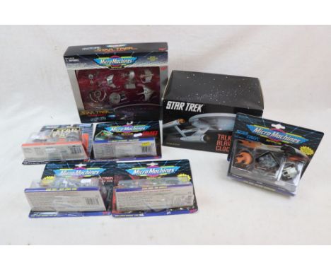 Six boxed and carded Micro Machines to include Star Trek The Next Generation, The Movies, Deep Space Nine,  #5 Galaxy Voyager