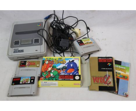 Super Nintendo SNES console plus boxed Super Mario World 2 game with instructions and 3 x game cartridges featuring Super Mar
