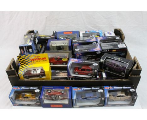Collection of 34 boxed Maisto diecast models featuring various series and models 