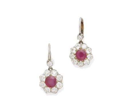 A pair of ruby and diamond ear pendantscentering two round brilliant-cut rubies measuring approximately 5.86 x 5.82 x 3.41mm;