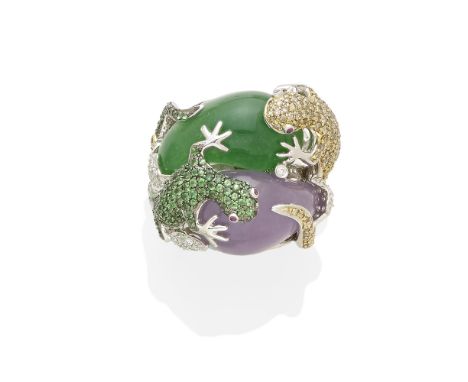 A jade and gem-set ringcentering two free-form jade cabochons of green and lavender jade; mounted in 18k white gold; gross we