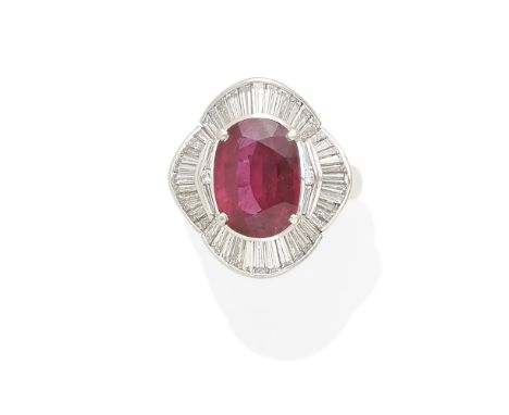A Ruby and Diamond ballerina Ringcentering an oval brilliant-cut ruby measuring approximately 12.61 x 9.23 x 5.22mm; mounted 