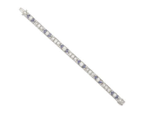 An Art Deco diamond and sapphire bracelet mounted in platinum; estimated total diamond weight: 4.55cts; length: 6 1/4in.