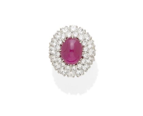 A synthetic ruby ringcentering an oval-cut cabochon synthetic ruby; mounted in sterling silver; with clear stones; size: 5Lot