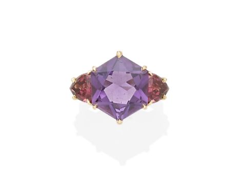 An amethyst and garnet ring,  Paolo Costaglicentering a hexagonal-cut amethyst measuring approximately 15.33 x 15.32 x 7.32mm