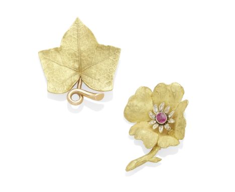 an ivy brooch and a ruby and diamond flower brooch mounted in two-tone 14k gold and 18k gold; gross weight approximately: 34 