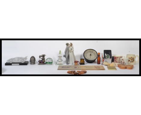 A collection of curios to include a millefiori glass paperweight and perfume bottle, a Lladro figure group of a married coupl