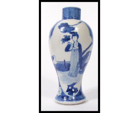 A 19th century blue and white Chinese vase decorated with a young maiden to each panel, peonies and character marks to base. 