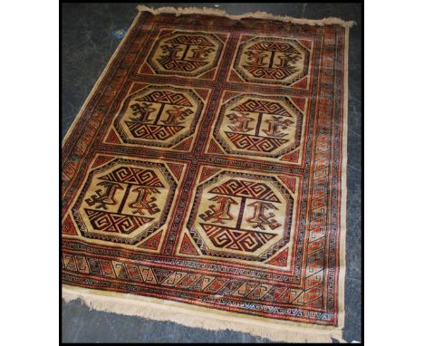 A large Iranian / Persian Keshan carpet - rug having red and beige ground with geometric 6 medallion decoration and borders w