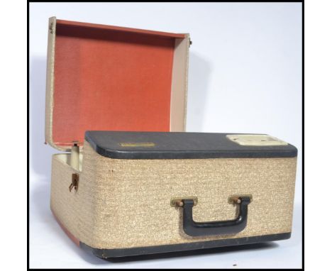 A vintage 20th century Ferguson four speed portable record player, the two tone case fitted with a four speed BSR record deck