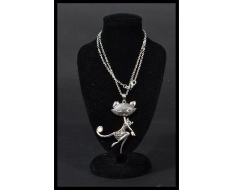 A sterling silver necklace chain and pendant in the form of an art deco cat with pearl panel to tail and marcasite body. In j