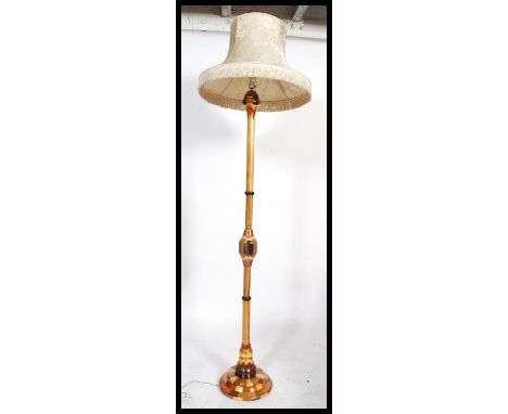 A stunning 20th century craftsman's sample wood standard lamp being made from many woods to include sapele wood, maple and ma