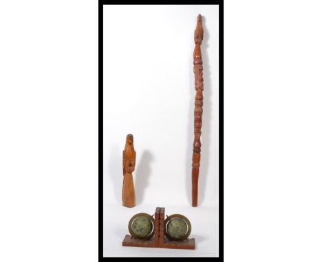 A 20th century carved painted walking stick designed to look like a South American totem surmounted with a Parrot together wi