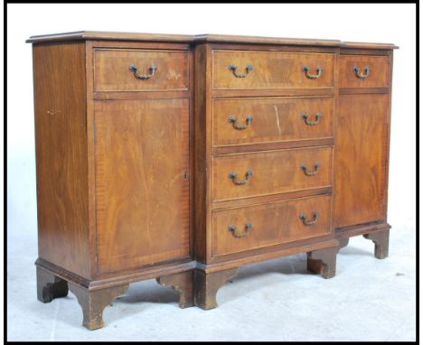 A good small proportions mahogany Regency revival break front sideboard being raised on bracket feet having a central bank of