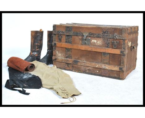A vintage early 20th century diddy box pertaining to a Vice Admiral containing various clothes with labels and names. The tru