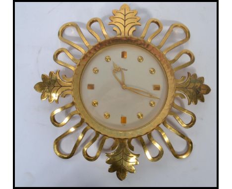 A vintage mid 20th century Swiss made 1950's IMHOF 15 jewel sunburst / starburst wall clock model 73 328 having an 8 day move