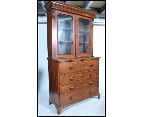 A 19th century solid mahogany secretaire bureau bookcase - chest of drawers being raised on bracket feet with a series of dra