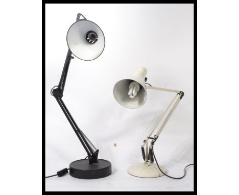 Two "Angelpoise" type adjustable desk lamps.&nbsp;Black lamp&nbsp;has detachable base and table clamp.