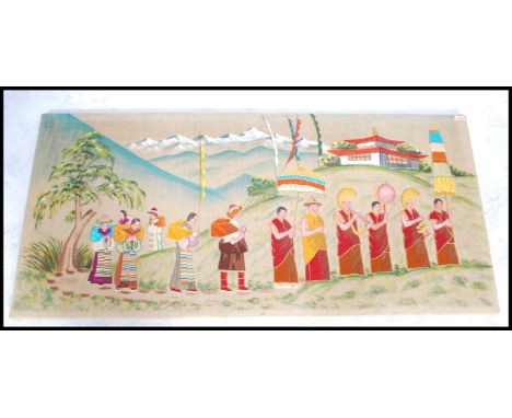 An unusual large early 20th century vintage Tibetan silk tapestry on wool panel being framed ready for hanging. Depicting mus