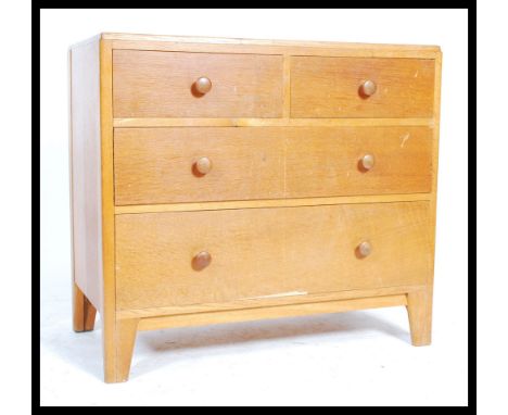 A mid 20th century Air Ministry golden oak chest of drawers having short and deep drawer configuration with knob handles. The
