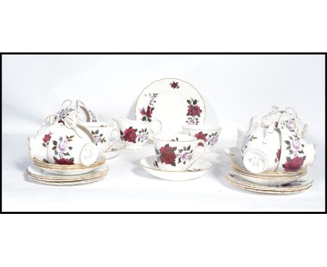 A vintage mid 20th century Colclough 12 person tea service in a floral pattern consisting of cups saucers and sides plate alo