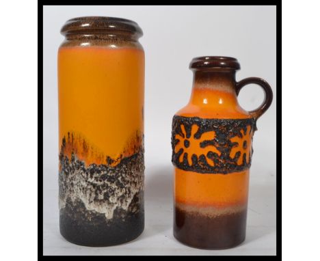 A vintage retro 20th century West German fat lava stick stand together with a West German ceramic ewer. Highest measures 42 c