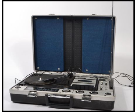 A vintage retro 20th century portable cased record player stereo / radiogram by Prinz. Designed to look like a suitcase havin