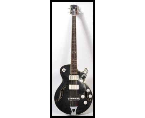 A good vintage ' Dominant ' Precision Musical Instruments hollow body bass guitar. 4 strings, with twin 'F' holes to the holl