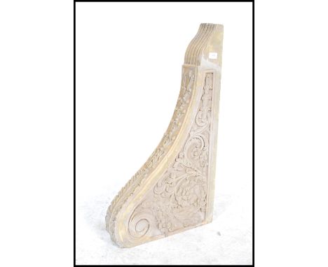 An 18th / 19th carved wall bracket / clock bracket support moulded in relief with foliate and floral swags.&nbsp;Measures: 80