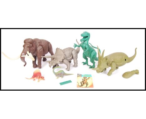 Four vintage 1970's Aurora ' Prehistoric Scenes ' plastic model animals to include; Woolly Mamouth, Allosaurus (736, with ins