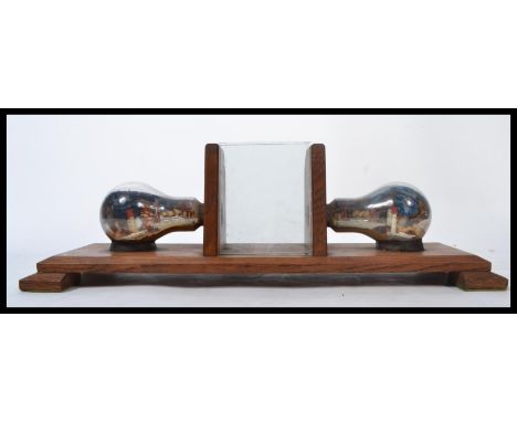A stunning scratch-built 20th century Art Deco desk top oak picture frame the central frame flanked by a pair of light-bulbs 