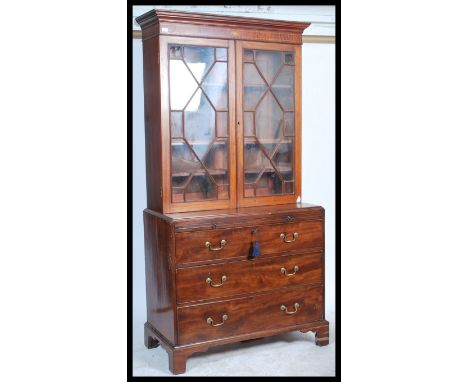 A 19th century Georgian bookcase on chest of drawers. Raised on bracket feet with a chest of drawers having a non-associated 