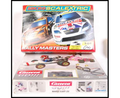 Two children's slot car racing sets comprising of; 1:43 scale Carrera Go 62206 Mario Kart DS set &amp; 1:64 scale Micro Scale