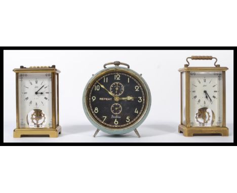 A pair of 20th century key wind brass carriage clocks by Shatz together with a vintage alarm clock by Bentima. it is 13.5cm&n