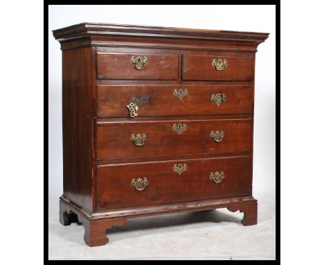 A 19th century Georgian mahogany chest of drawers raised on ogee bracket feet with a series of short and deep drawers having 