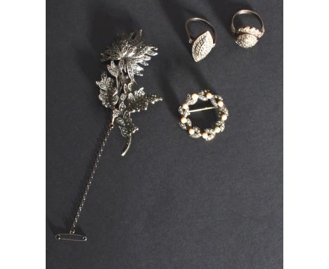A group of marcasite jewellery to include a flower brooch , seed pearl brooch and two rings.
