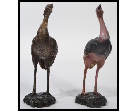 A pair of 20th century bronze cast figurines - sculptures of Ostrich to include a male and a female in the manner of Bergman.