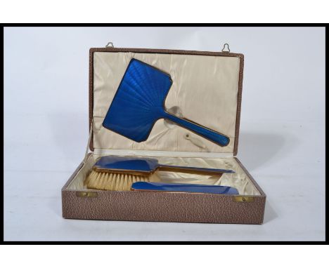 A vintage 20th century cased Blue Guilloche enamel&nbsp; vanity set comprising mirrors and brushes etc. Complete in a faux Sh
