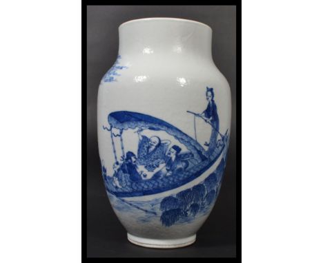 A 19th century blue and white Chinese vase having a tapered neck and rim with hand painted scenes of men playing a betting ga