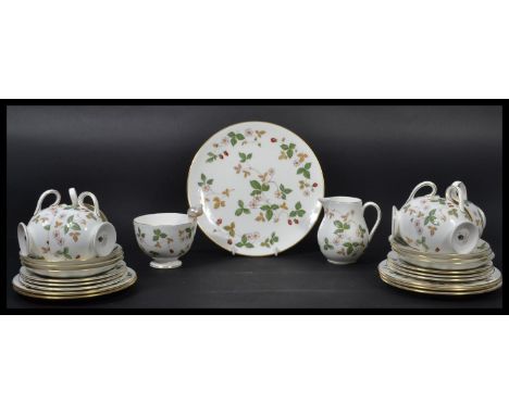 A vintage Wedgwood Wild Strawberry pattern tea service consisting of cups , saucers , side plates , creamer jug , sugar bowl 