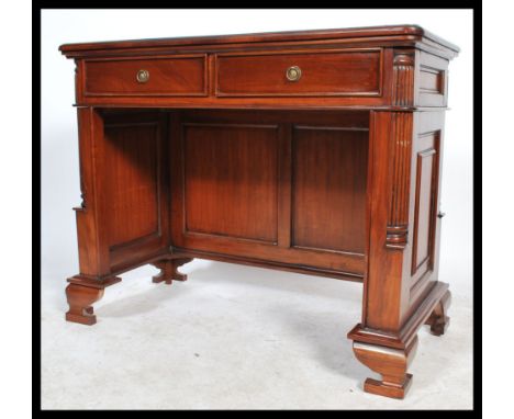 A 20th century antique style mahogany writing table / desk, green tooled leather scribe to the top to drawers to the front ra