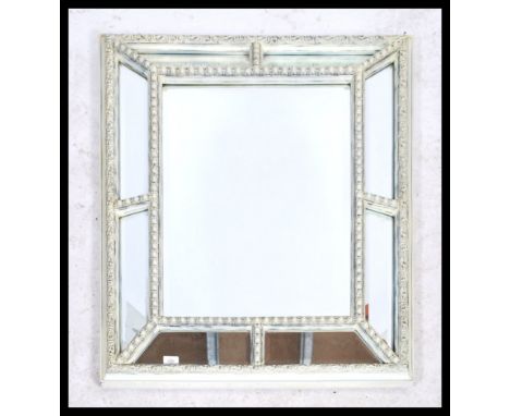 A 20th century Venetian style cushion mirror. Of rectangular form with mirror panel cushion sides surrounding the central mir