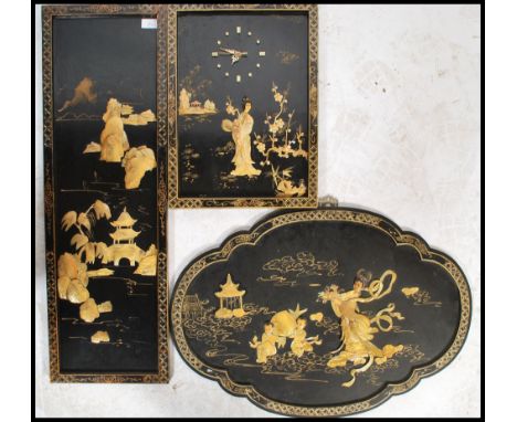 A collection of three Chinese lacquer and chinoserie shibiyama wall plaques decorated with mother of pearl showing Geisha gir